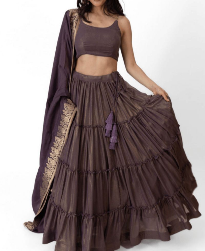 Women's Brownish Purple Shimmer Tiered Lehenga Choli with Golden Accents