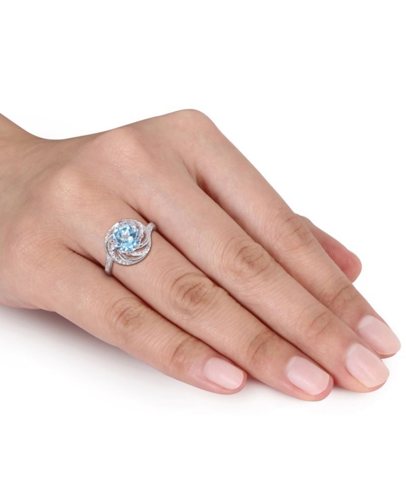 Blue Topaz (2-1/3 ct.t.w.), White Topaz (1/8 ct. t.w.) and Diamond Accent Interlaced Swirl Halo Ring in Sterling Silver